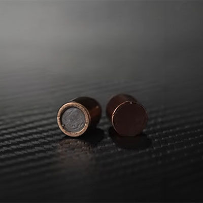 two bullets laying on a table