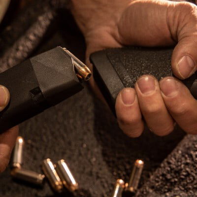 magazine being loaded into a handgun