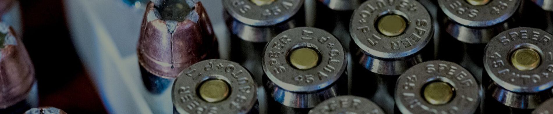 Father helping son learn about reloading