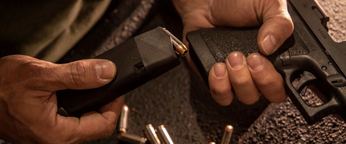 magazine being loaded into a handgun