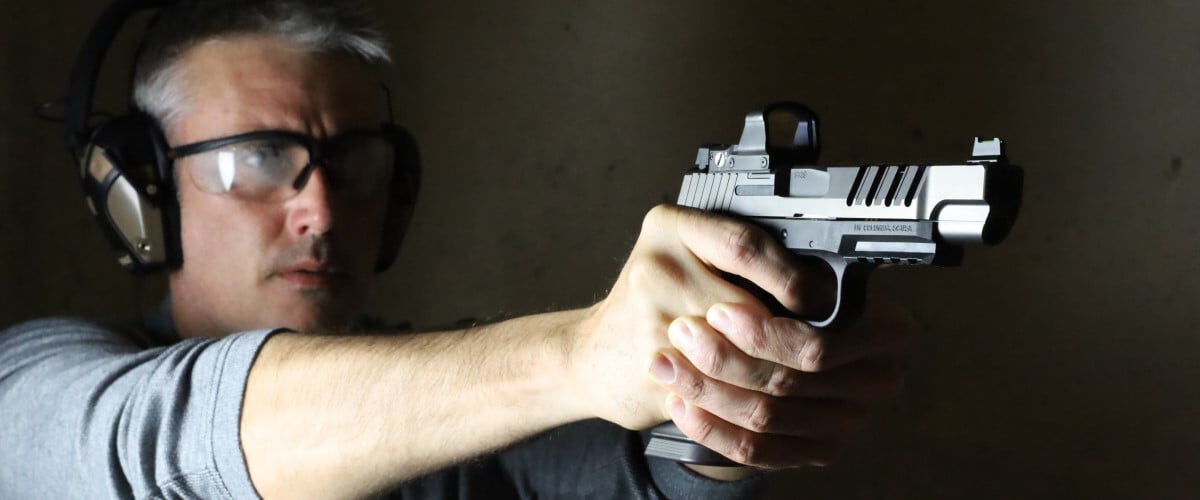 shooter aiming pistol