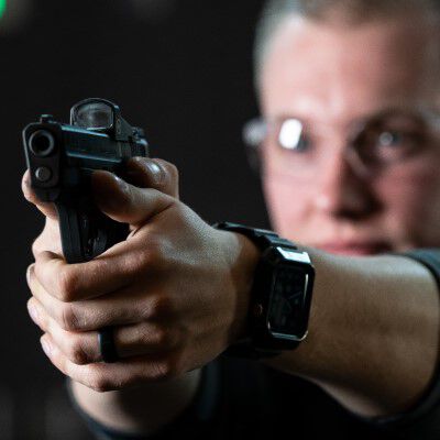 shooter aiming a handgun