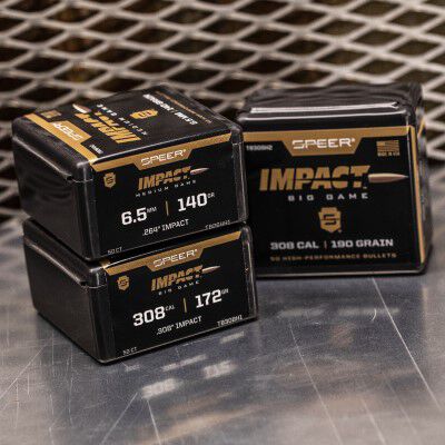 Speer Impact ammo packaing stacked on a table