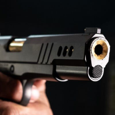 shooter aiming handgun
