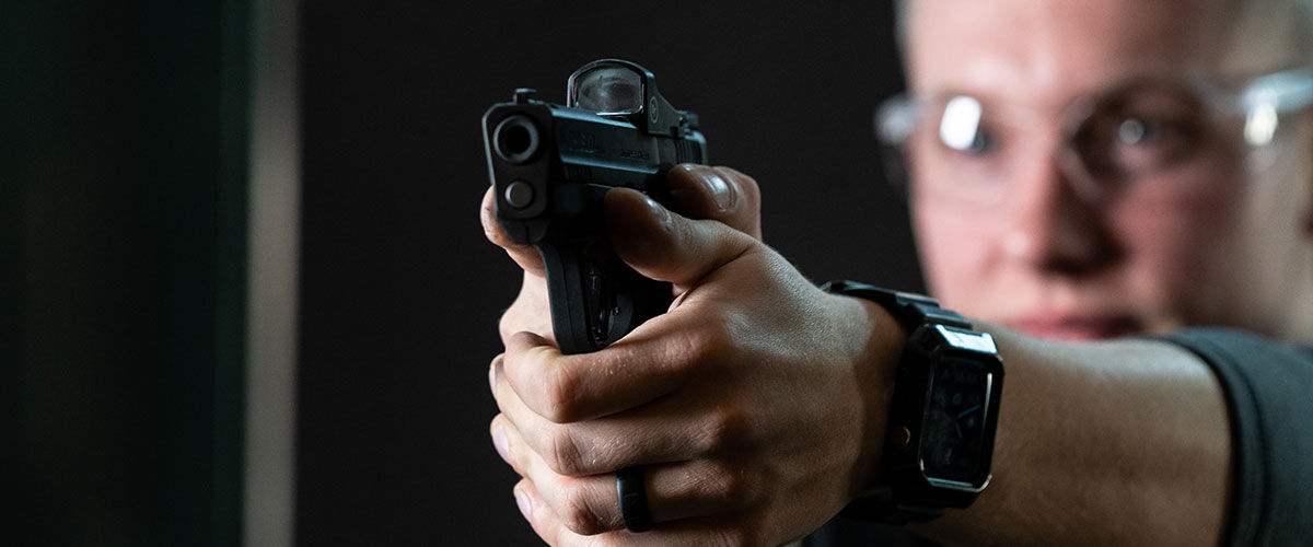 shooter aiming a handgun