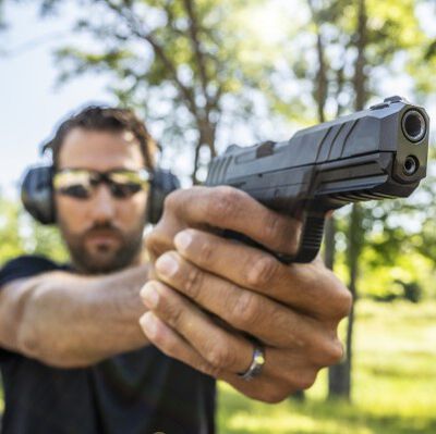 man pointing a pistol