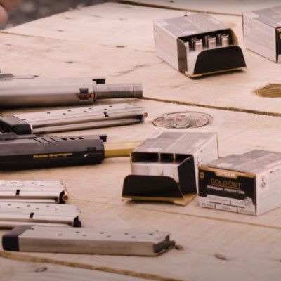 speer packaging and pistols lying on a table