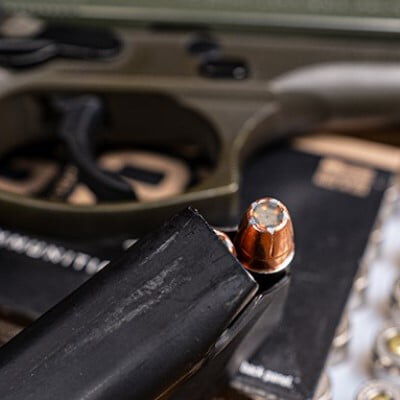 handgun, G2 packaing, and G2 cartridges in a magazine