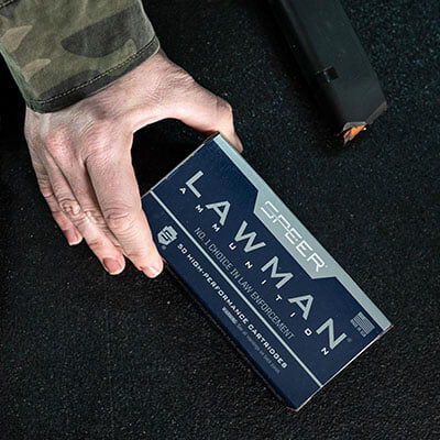 person holding box of Lawman