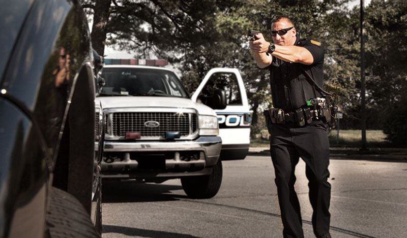 Police Pointing Handgun during police stop