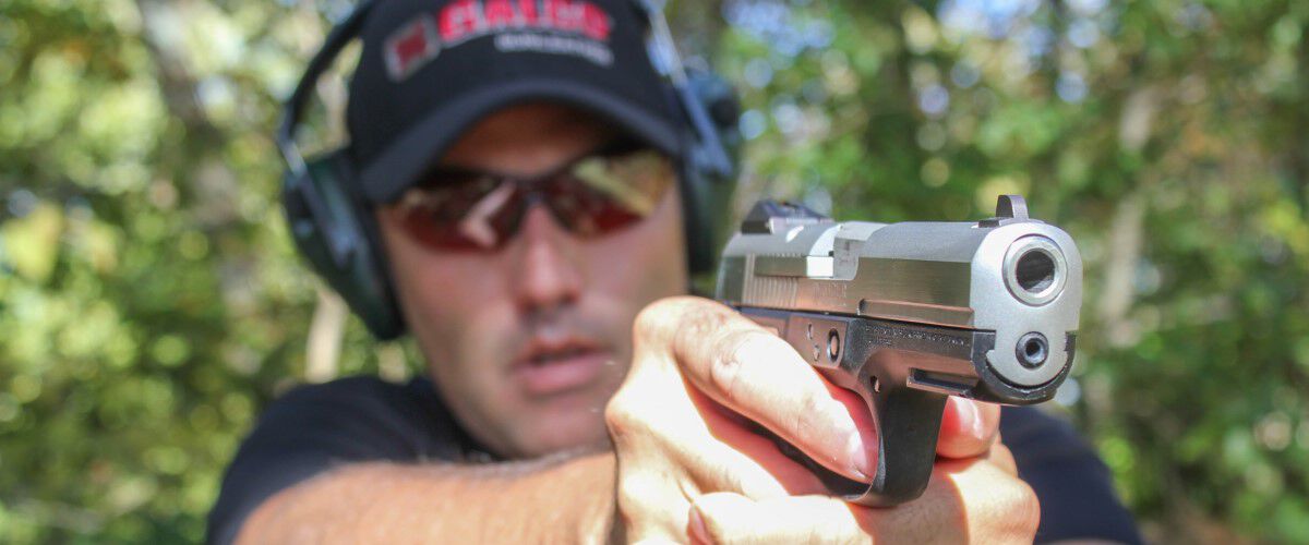 shooter aiming a pistol