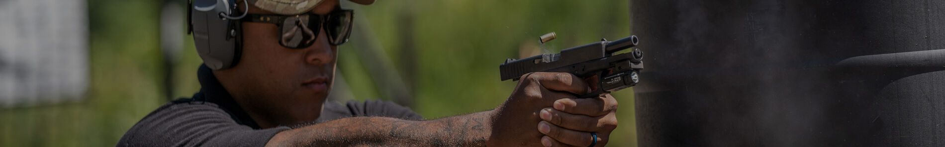 shooter aiming handgun