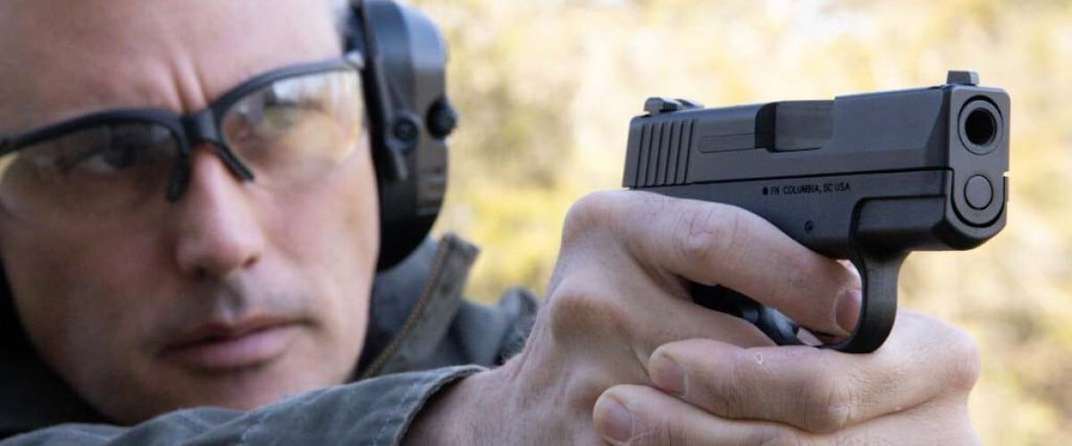 shooter aiming pistol