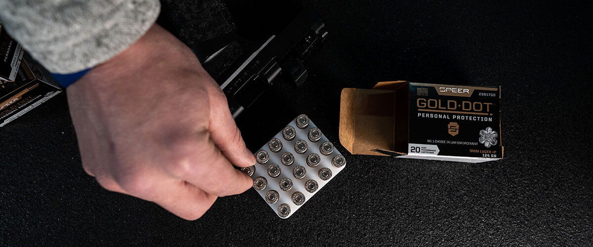 Gold Dot cartridges being removed from a box