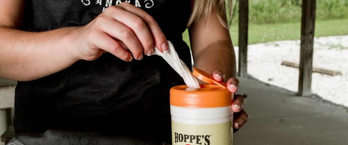 Hoppe's wipes being removed from their container