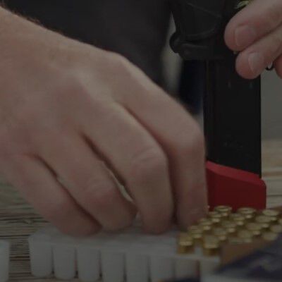 man pointing a pistol outside