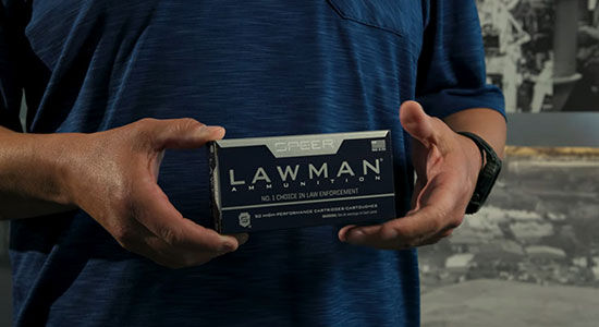 Person holding box of Lawman