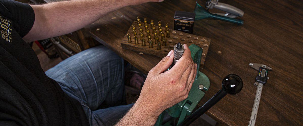 Man loading bullet cartridges