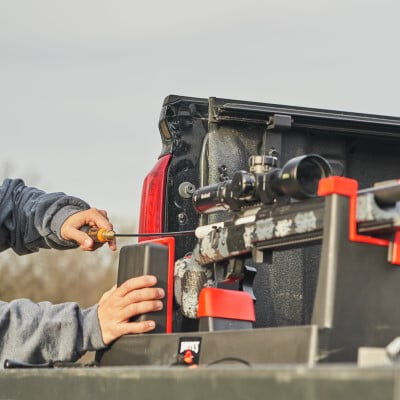 rifle being cleaned while on a stand