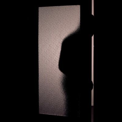 shadow of person sneaking through an open door