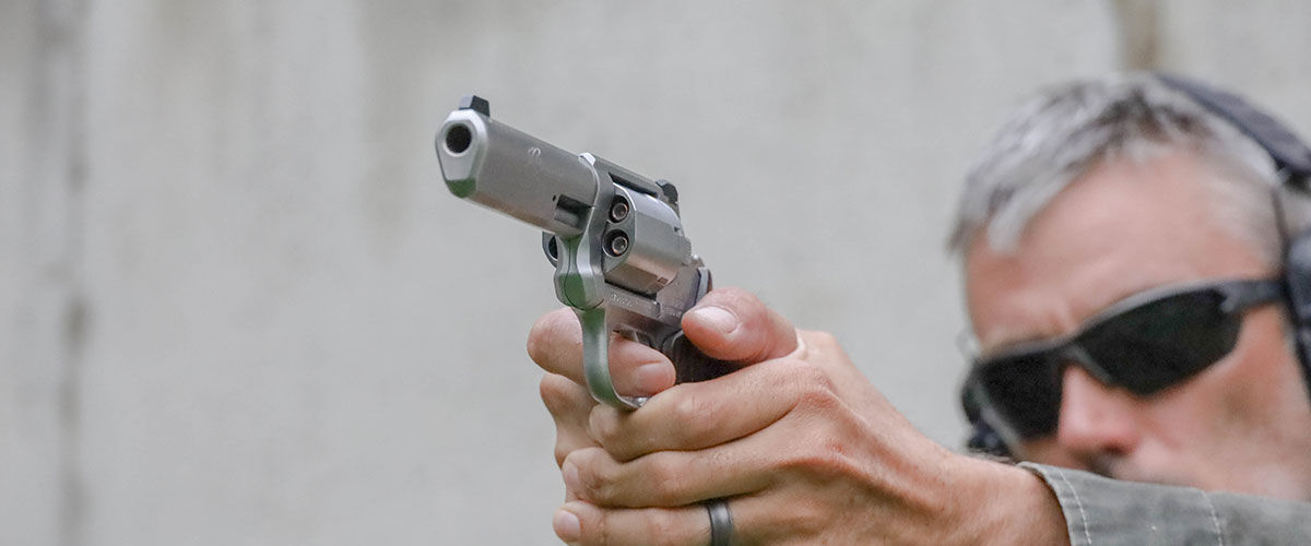 shooter aiming a revolver