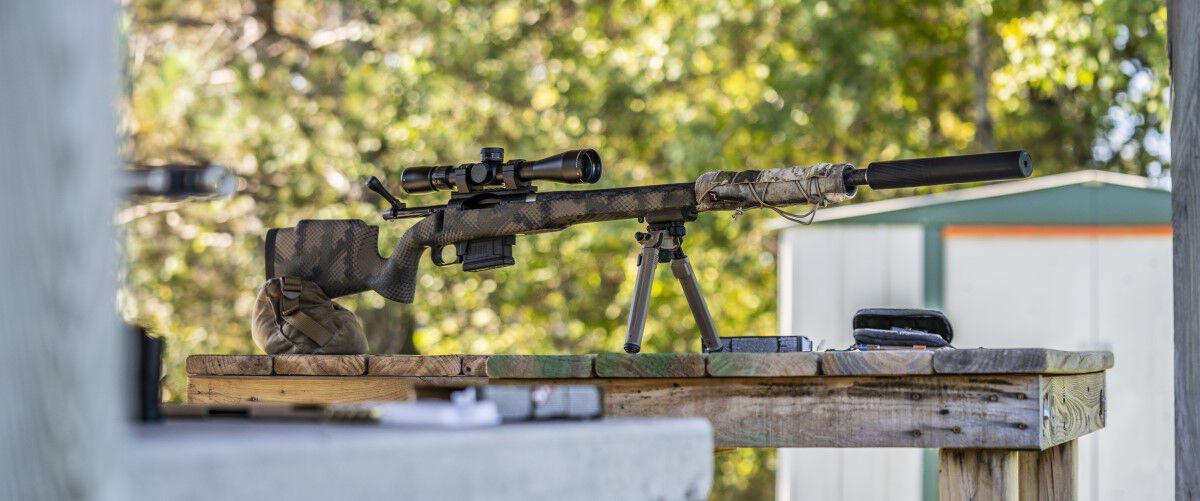 Rifle resting on a pallet and a bipod