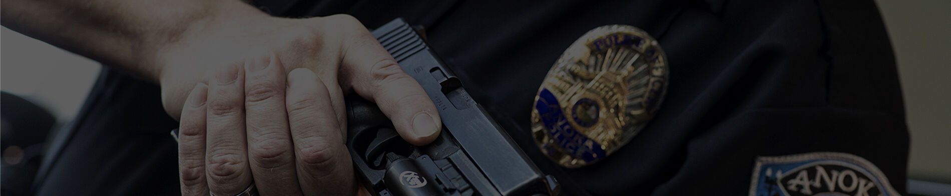 police holding a handgun