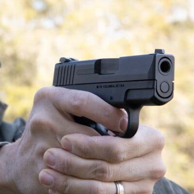 shooter aiming pistol