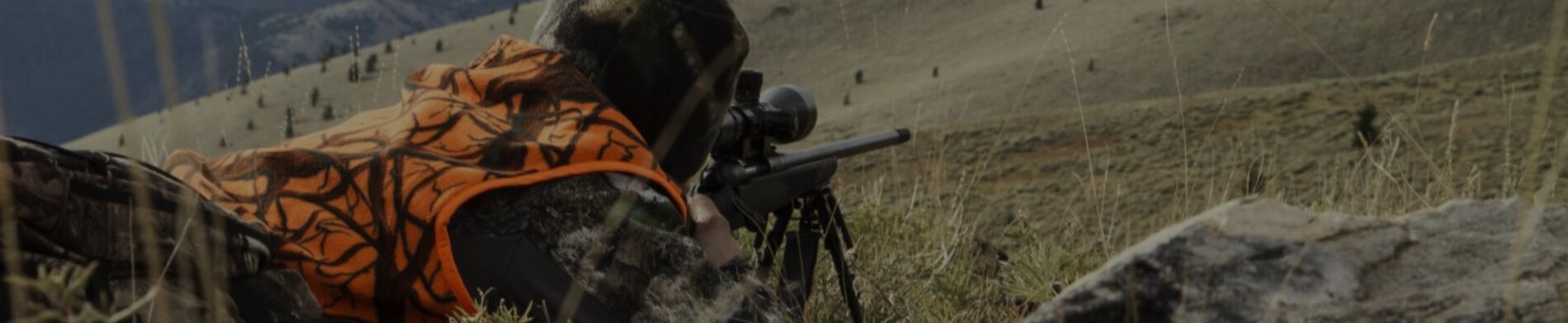 Hunter Shooting a Rifle