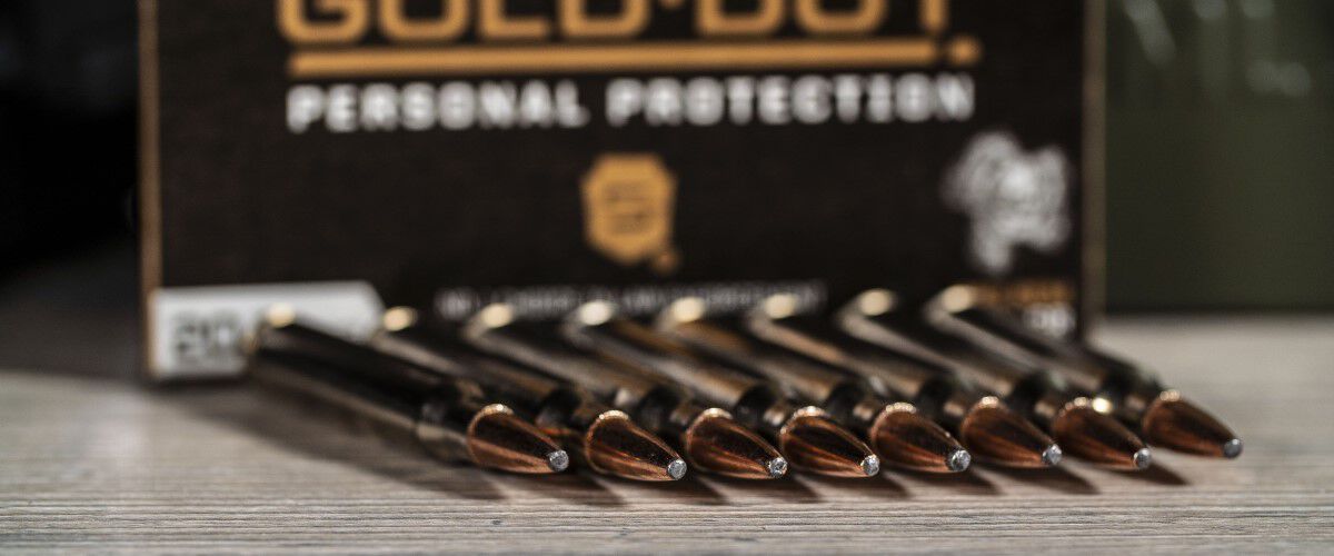 Speer Gold Dot Personal Protection 223 Cartridges laying on a table
