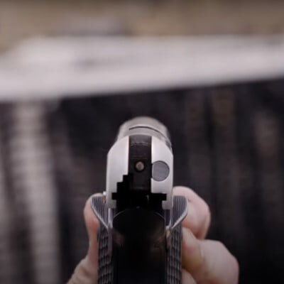 looking down the barrel of a handgun
