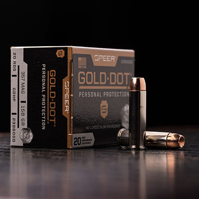 Gold Dot Short Barrel Personal Protection 357 Magnum box and cartridges on a table
