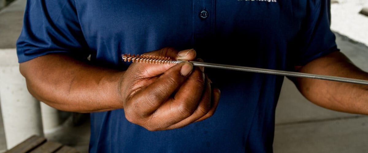 cleaning rod being held in a hand