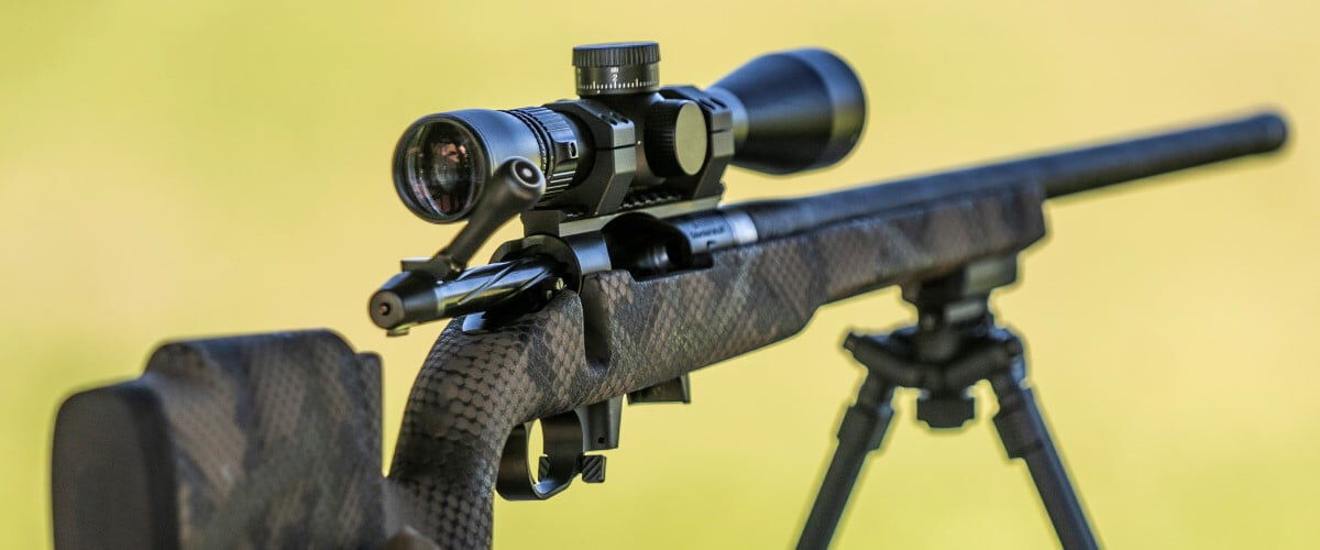 rifle with a scope on a bipod
