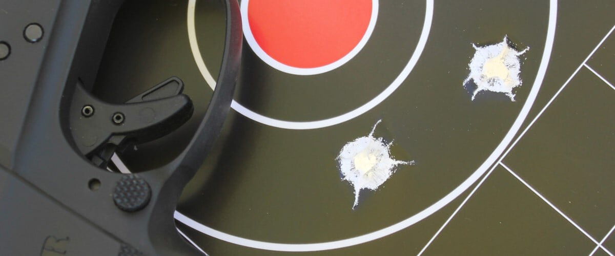 shot target with a handgun on top