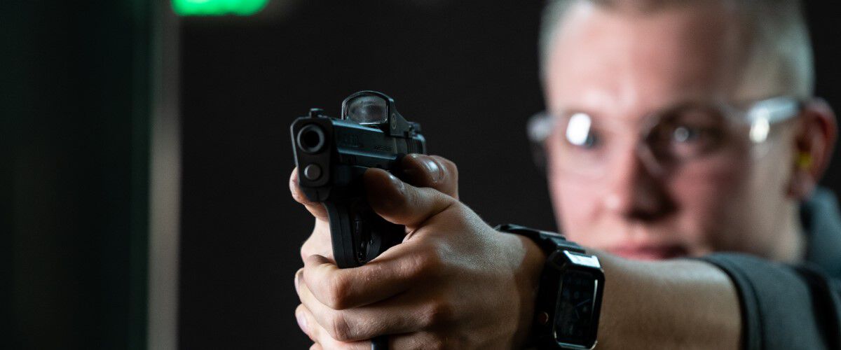 shooter aiming a handgun