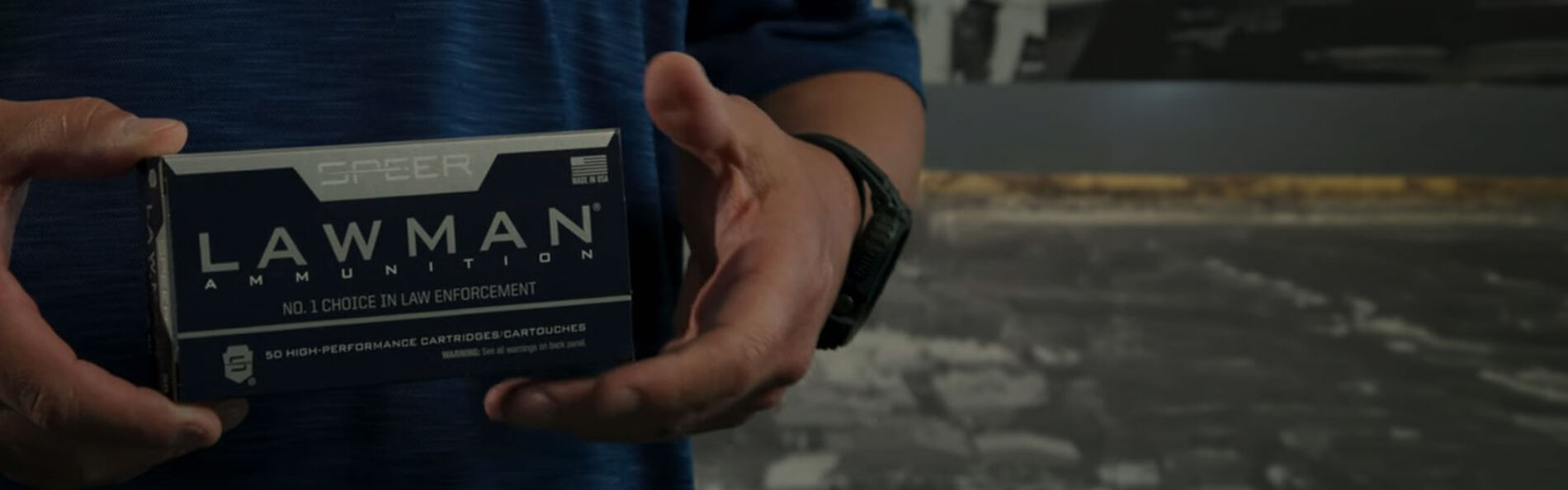 person holding box of Lawman